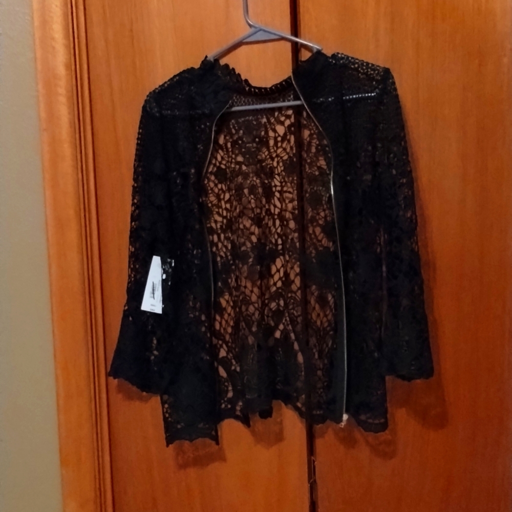 It does not fit me,size small from J.C. Penney. It is black and never been used.